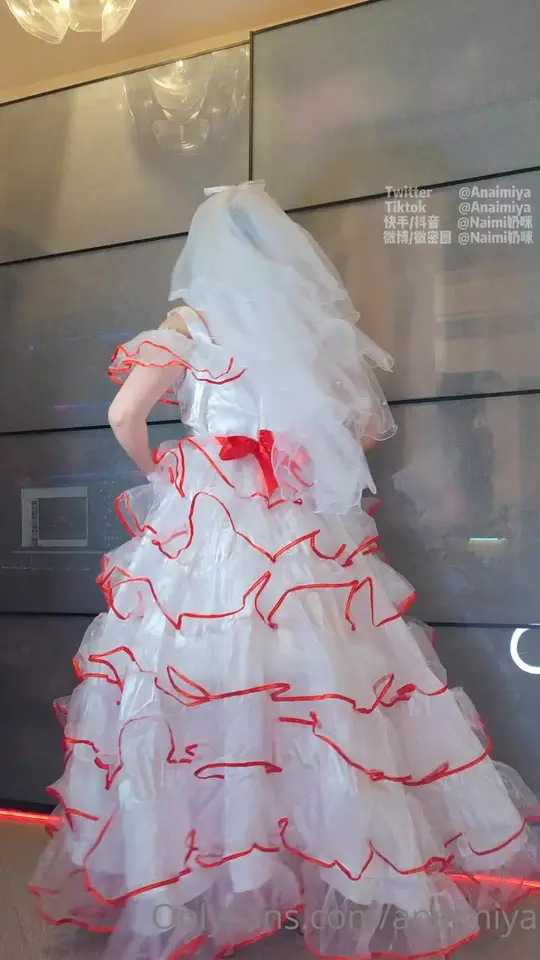 Masked Bride Teases in Ruffled Gown