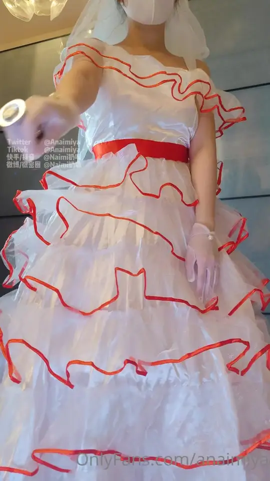 Masked Bride Teases in Ruffled Gown