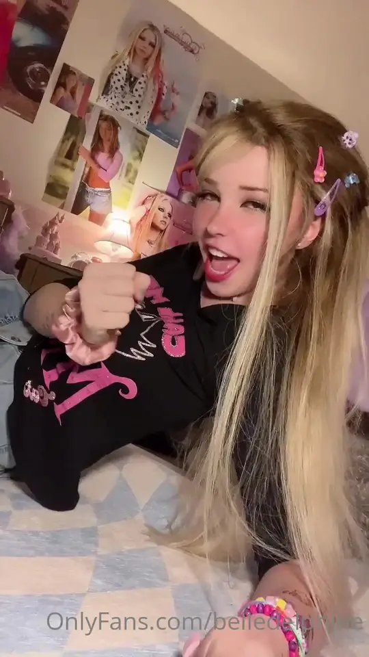 Playful blonde poses and talks in bedroom