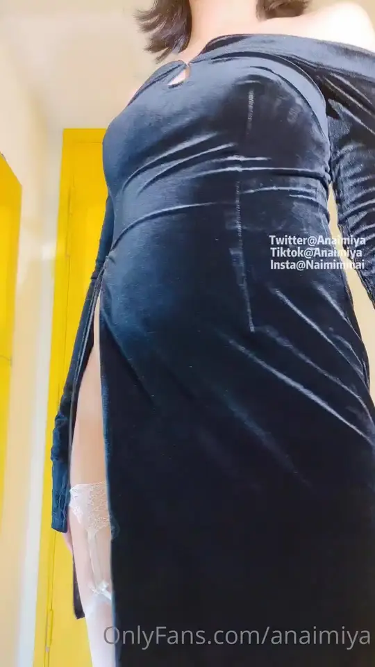 Masked woman flashes velvet dress in hallway