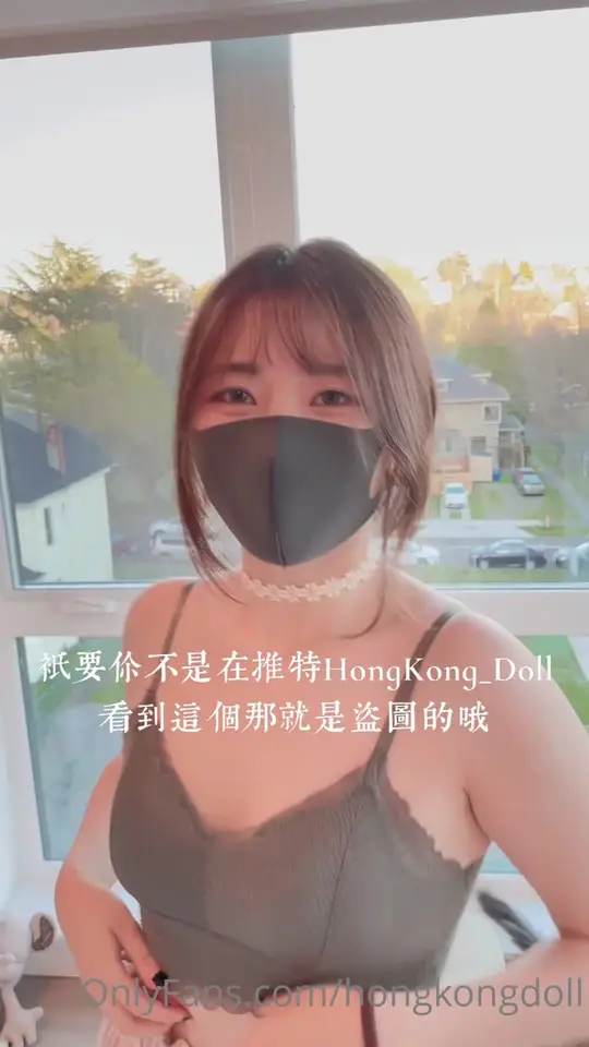 Masked woman teases then flashes bralette
